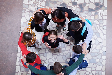 Image showing group of happy young people showing their unity.