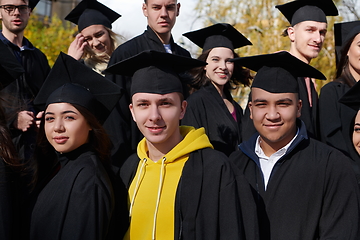 Image showing Group of diverse international graduating students celebrating