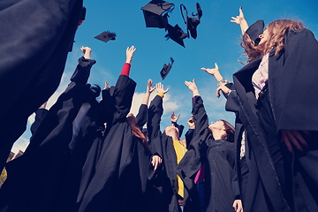 Image showing Group of diverse international graduating students celebrating