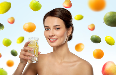 Image showing woman drinking water with lemon and ice