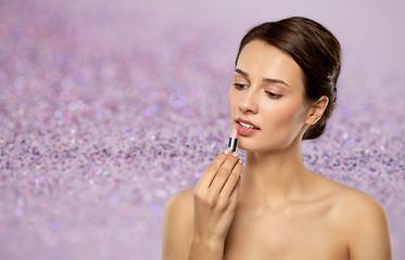 Image showing beautiful smiling young woman with pink lipstick