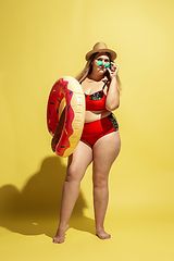 Image showing Young caucasian plus size female model\'s preparing for beach resort