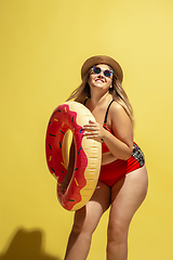 Image showing Young caucasian plus size female model\'s preparing for beach resort