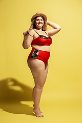 Image showing Young caucasian plus size female model\'s preparing for beach resort