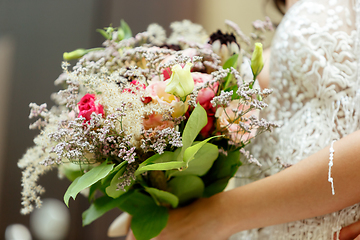 Image showing Caucasian romantic young bride celebrating his marriage in city