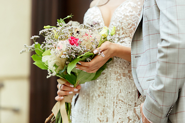 Image showing Caucasian romantic young couple celebrating their marriage in city