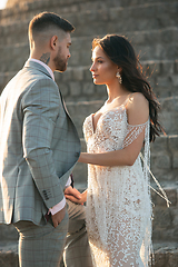 Image showing Caucasian romantic young couple celebrating their marriage in city