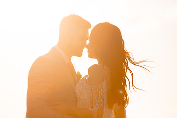 Image showing Caucasian romantic young couple celebrating their marriage in city