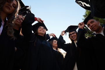 Image showing Group of diverse international graduating students celebrating