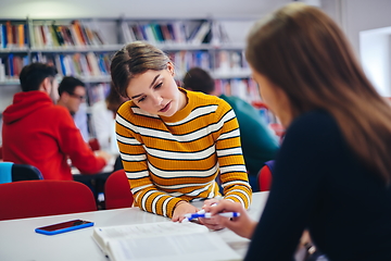 Image showing students group working on school project together on tablet computer at modern university