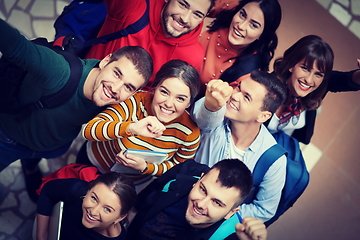 Image showing group of happy young people showing their unity.