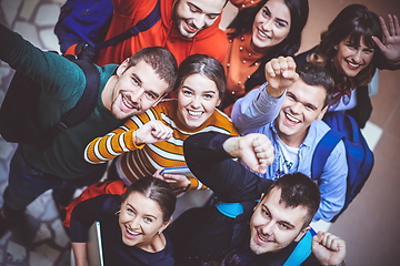 Image showing group of happy young people showing their unity.