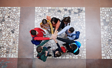 Image showing group of happy young people showing their unity.