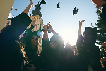 Image showing Group of diverse international graduating students celebrating