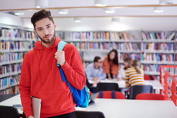 Image showing the student uses a laptop and a school library