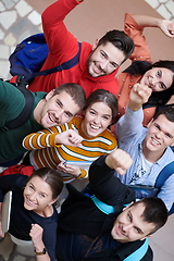 Image showing group of happy young people showing their unity.