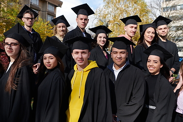 Image showing Group of diverse international graduating students celebrating