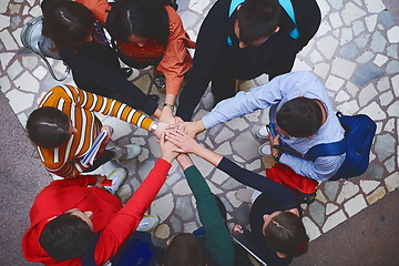 Image showing group of happy young people showing their unity.