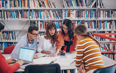 Image showing students group working on school project together on tablet computer at modern university