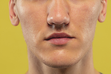 Image showing Caucasian young man\'s close up shot on yellow background