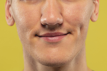 Image showing Caucasian young man\'s close up shot on yellow background