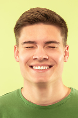 Image showing Caucasian young man\'s close up shot on green background