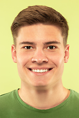 Image showing Caucasian young man\'s close up shot on green background