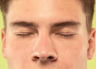 Image showing Caucasian young man\'s close up shot on green background