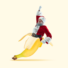 Image showing Happy Christmas Santa Claus on yellow studio background