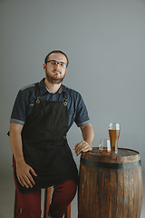 Image showing Confident young male brewer with self crafted beer