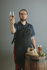 Image showing Confident young male brewer with self crafted beer