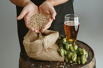 Image showing Close up of confident young man brewer with self crafted beer