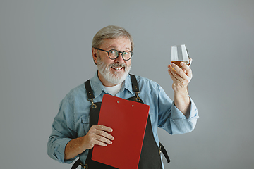 Image showing Confident senior man brewer with self crafted beer