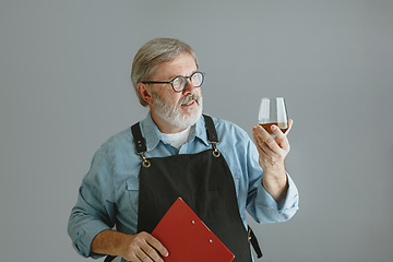 Image showing Confident senior man brewer with self crafted beer