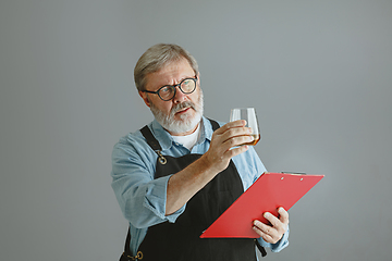 Image showing Confident senior man brewer with self crafted beer