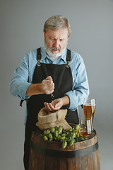 Image showing Confident senior man brewer with self crafted beer