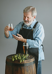 Image showing Confident senior man brewer with self crafted beer