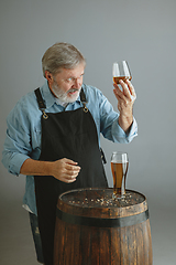 Image showing Confident senior man brewer with self crafted beer