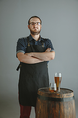 Image showing Confident young male brewer with self crafted beer