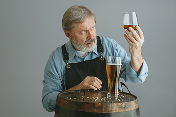 Image showing Confident senior man brewer with self crafted beer