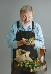 Image showing Confident senior man brewer with self crafted beer