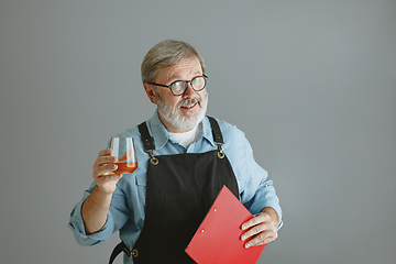 Image showing Confident senior man brewer with self crafted beer