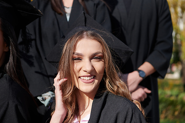 Image showing Group of diverse international graduating students celebrating