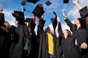 Image showing Group of diverse international graduating students celebrating