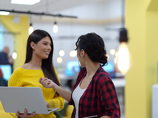 Image showing female friends discussion about project at moder coworking office