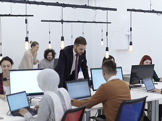 Image showing creative business people group as freelancers in modern coworking open space office