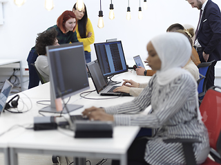 Image showing african muslim business woman at office as part of creative team