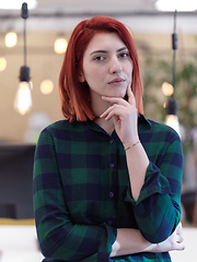 Image showing redhead business woman portrait in creative modern coworking startup open space office