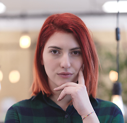 Image showing redhead business woman portrait in creative modern coworking startup open space office