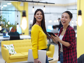 Image showing female friends discussion about project at moder coworking office